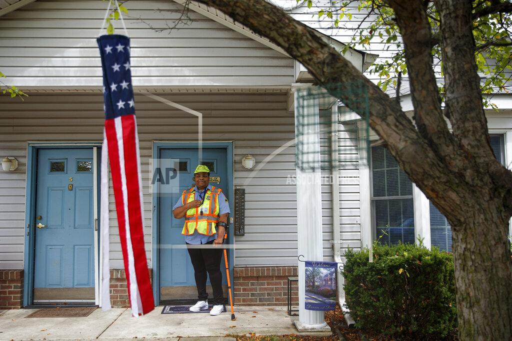 Matt Slocum Patrice Jetter, a furloughed school crossing guard, poses for a photograph, Thursday, July 23, 2020, in Hamilton, N.J. Jetter, who has cerebral palsy and partial hearing loss, wanted to work with kids when graduating from high school. (AP Photo/Matt Slocum)