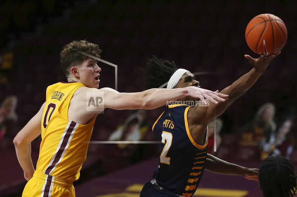 Stacy Bengs UMKC guard Demarius Pitts (2) tries to shoot the ball against Minnesota center Liam Robbins (0) during an NCAA college basketball game Thursday, Dec. 10, 2020, in Minneapolis. (AP Photo/Stacy Bengs)