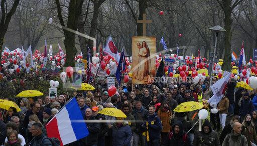 Thousands of demonstrators march in Utrecht, Netherlands, Saturday, Dec. 4, 2021, to protest against COVID-19 restrictions and the lockdown. (AP Photo/Peter Dejong)