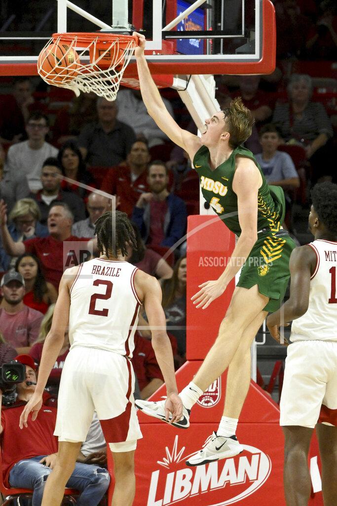 Michael Woods North Dakota State guard forward Grant Nelson (4) dunks against Arkansas during the second half of an NCAA college basketball game Monday, Nov. 7, 2022, in Fayetteville, Ark. (AP Photo/Michael Woods)