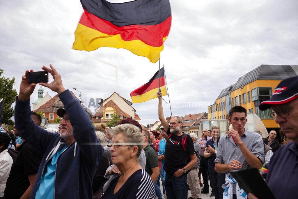 Markus Schreiber FILE - In this Thursday, Aug. 15, 2019 file photo, a crowd of people attend an election campaign rally of German Alternative for Germany, AfD, party for the Saxony state elections in Bautzen, Germany. Migration is a side issue in this year's German election campaign for the national elections on Sept. 26, but that hasn't stopped the country's biggest far-right party from trying to play it up. (AP Photo/Markus Schreiber, file)