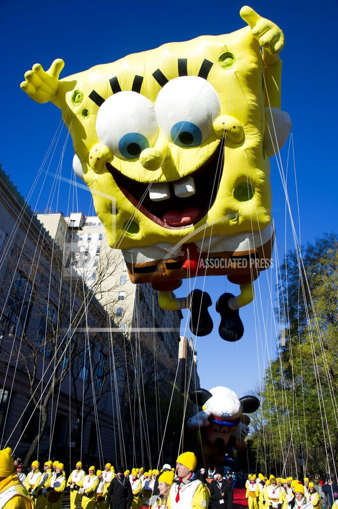 FILE - In this Nov. 4, 2011, file photo, the SpongeBob SquarePants balloon floats in the Macy's Thanksgiving Day Parade in New York. A sense of humor and a dash of creativity, along with memes from "The Office," "SpongeBob SquarePants" and the "Real Housewives" franchise, helped NFL teams' social-media crews tell the story of free agency in the age of the coronavirus before deals eventually were allowed to just be announced normally. (AP Photo/Charles Sykes, File)