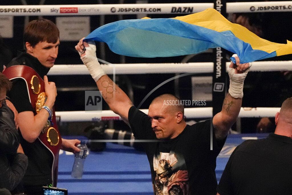 Frank Augstein Oleksandr Usyk of Ukraine celebrates after his unanimous decision victory over Anthony Joshua of Britain in their WBA (Super), WBO and IBF boxing title bout at the Tottenham Hotspur Stadium in London, Saturday, Sept. 25, 2021. (AP Photo/Frank Augstein)