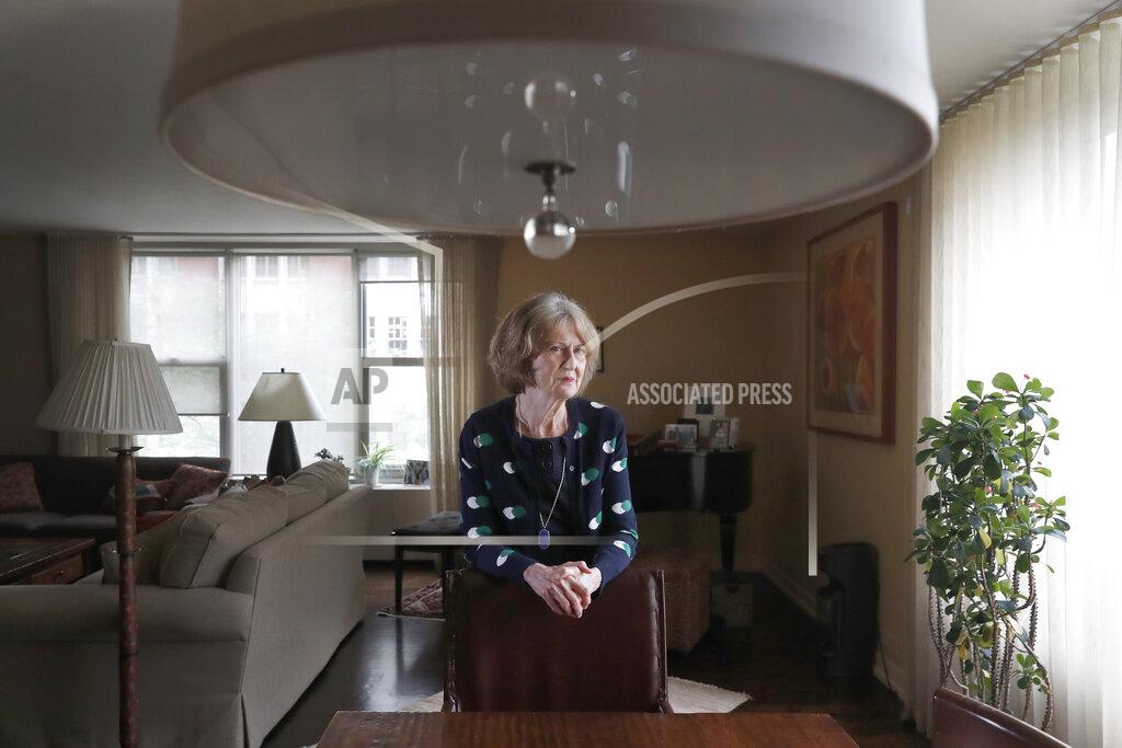Charles Rex Arbogast Senior U.S. District Judge Joan Lefkow, poses Monday, July 27, 2020, for a portrait in her Chicago home. In 2005, Lefkow returned from work to find her husband and mother shot dead in the basement of her Chicago home. Lefkow was forced to relive her family tragedy this month when a struggling lawyer armed with a gun and a grudge opened fire at the home of another female judge. (AP Photo/Charles Rex Arbogast)