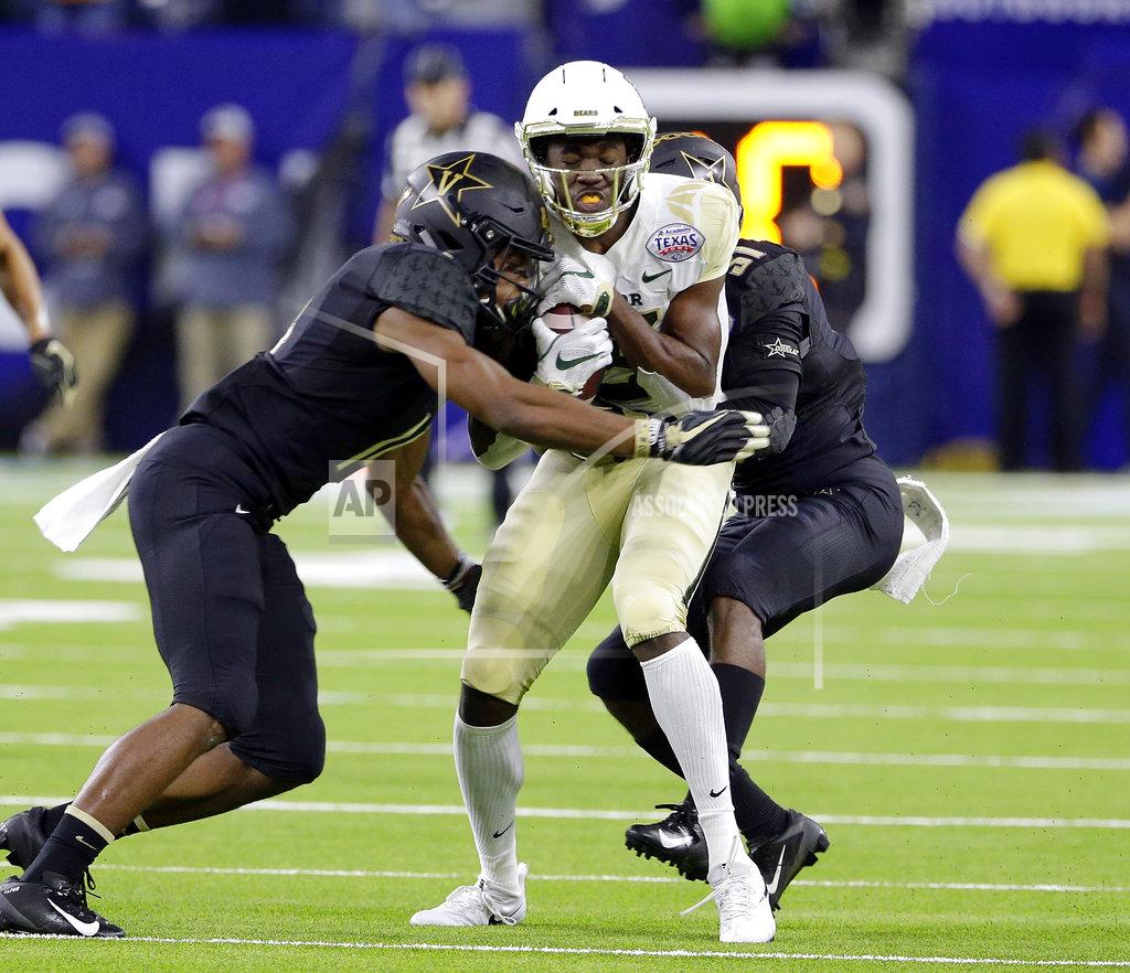Michael Wyke Baylor wide receiver Denzel Mims, center, is caught between Vanderbilt defensive back Max Worship, left and defensive back Alim Muhammad, right, during the first half of the Texas Bowl NCAA college football game Thursday, Dec. 27, 2018, in Houston. (AP Photo/Michael Wyke)