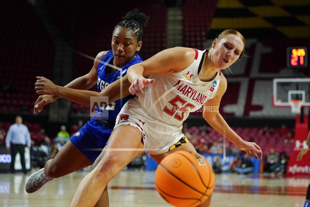 Julio Cortez Maryland forward Chloe Bibby (55) and Florida Gulf Coast guard Kerstie Phills compete for a loose ball during the second half of a college basketball game in the second round of the NCAA tournament, Sunday, March 20, 2022, in College Park, Md. Maryland won 89-65. (AP Photo/Julio Cortez)