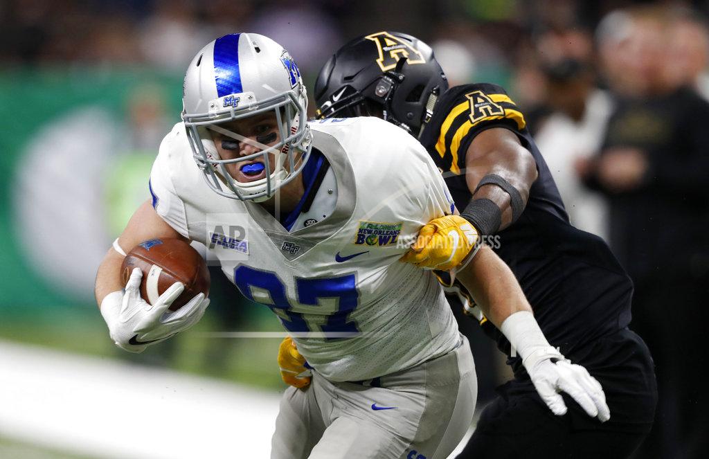 Gerald Herbert Middle Tennessee wide receiver Gatlin Casey (87) is tackled by Appalachian State defensive back Tae Hayes (17) in the first half of the New Orleans Bowl NCAA college football game in New Orleans, Saturday, Dec. 15, 2018. (AP Photo/Gerald Herbert)