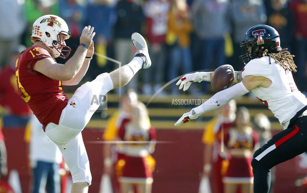 Charlie Neibergall Texas Tech defensive back Thomas Leggett blocks a punt by Iowa State punter Corey Dunn, left, during the first half of an NCAA college football game, Saturday, Oct. 27, 2018, in Ames, Iowa. Leggett recovered the block in the end zone for a Texas Tech touchdown. (AP Photo/Charlie Neibergall)
