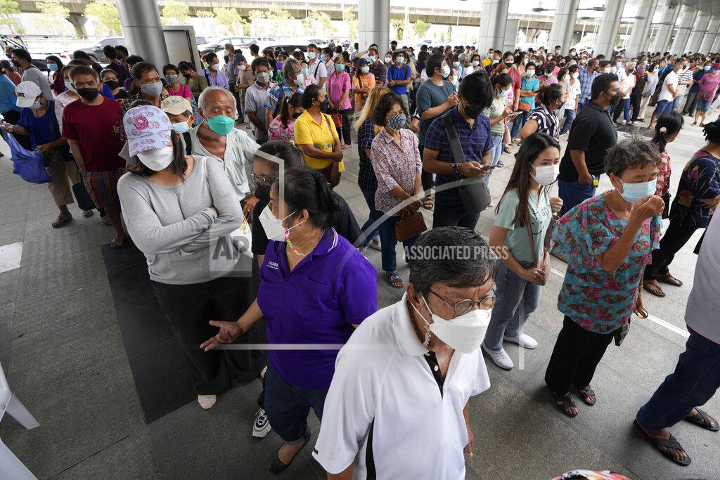 Sakchai Lalit Residents wait on line to receive shots of the AstraZeneca COVID-19 vaccine at the Central Vaccination Center in Bangkok, Thailand, Thursday, July 22, 2021. (AP Photo/Sakchai Lalit)