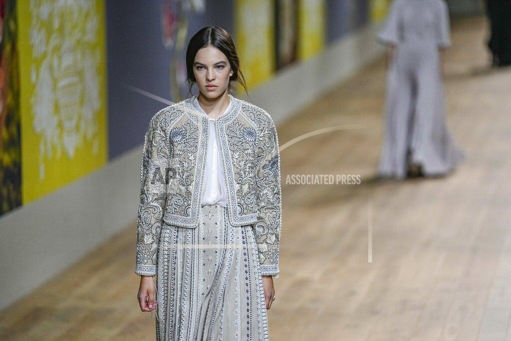 Michel Euler A model wears a creation as part of Dior's Haute Couture Fall/Winter 2022-2023 fashion collection presented Monday, July 4, 2022 in Paris. (AP Photo/Michel Euler)