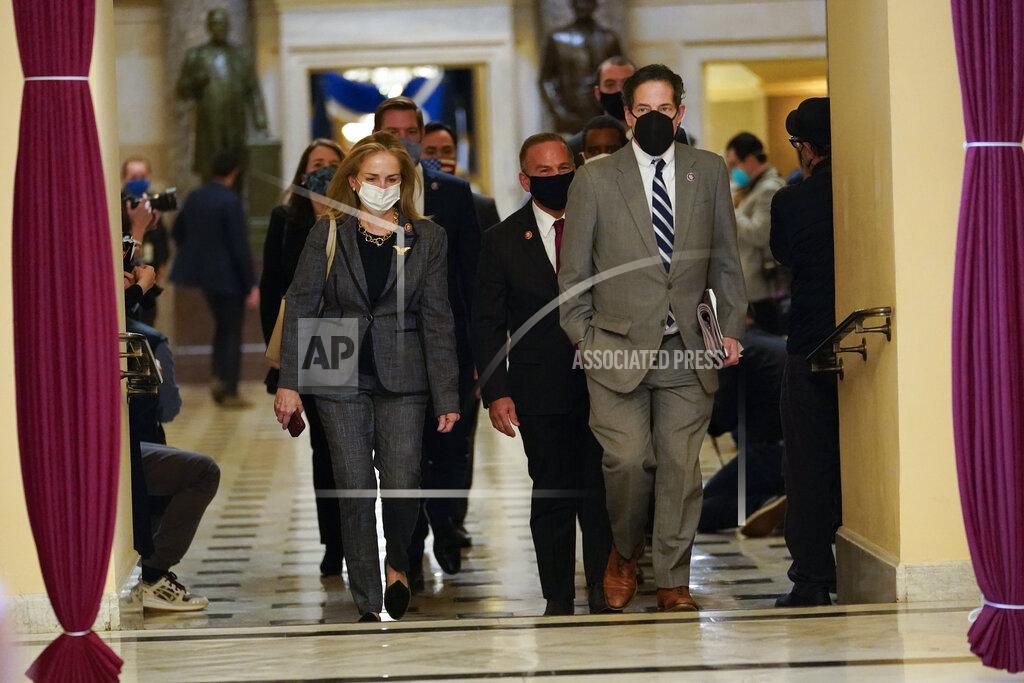 Susan Walsh Impeachment managers Rep. Madeleine Dean, D-Pa., and Rep. Jamie Raskin, D-Md., walk to the House chamber on Capitol Hill in Washington, Wednesday, Jan. 13, 2021. (AP Photo/Susan Walsh)