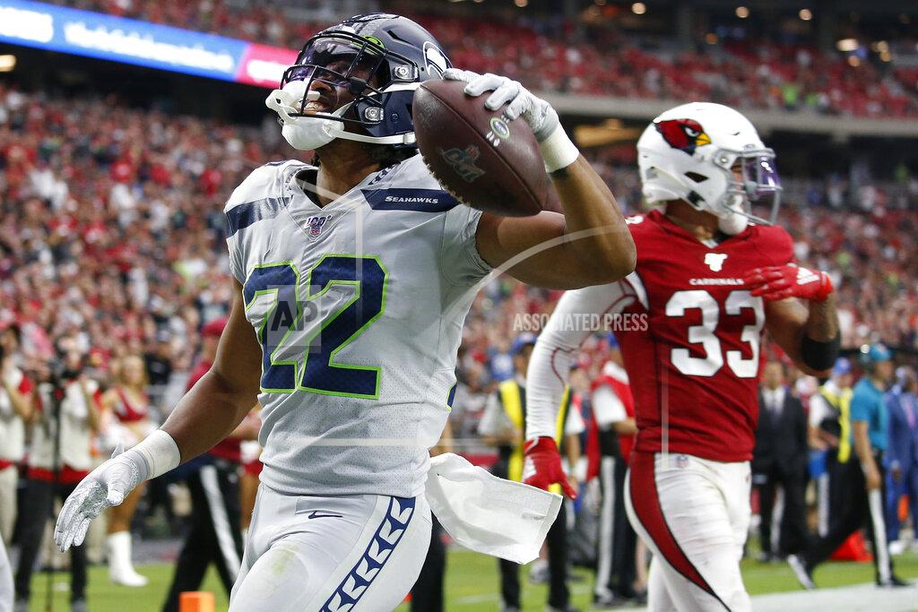 Ross D. Franklin Seattle Seahawks running back C.J. Prosise (22) scores a touchdown against the Arizona Cardinals during the second half of an NFL football game, Sunday, Sept. 29, 2019, in Glendale, Ariz. (AP Photo/Ross D. Franklin)
