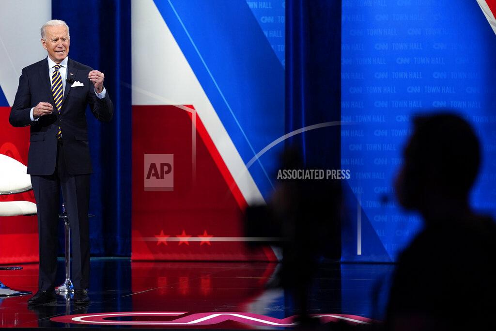 President Joe Biden answers questions during a televised town hall event at Pabst Theater, Tuesday, Feb. 16, 2021, in Milwaukee. (AP Photo/Evan Vucci)