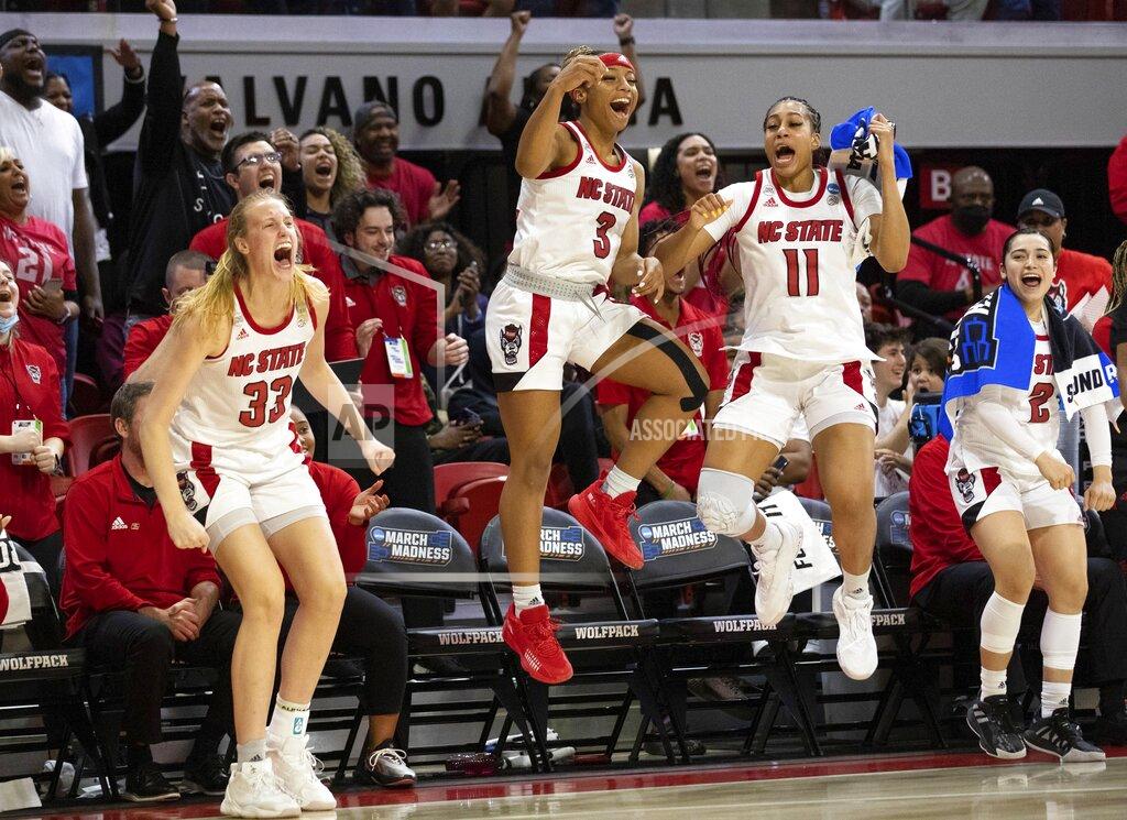 Ben Mckeown North Carolina State's Elissa Cunane (33), Kai Crutchfield (3), Jakia Brown-Turner (11) and Raina Perez (2) react to a play in the final minutes of a college basketball game against Kansas State in the second round of the NCAA tournament in Raleigh, N.C., Monday, March 21, 2022. (AP Photo/Ben McKeown)