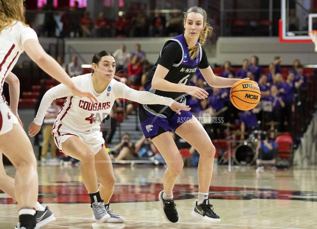 Ben Mckeown Kansas State's Serena Sundell, right, handles the ball as Washington State's Krystal Leger- Walker, left, defends during the first half of a college basketball game in the first round of the NCAA tournament in Raleigh, N.C., Saturday, March 19, 2022. (AP Photo/Ben McKeown)