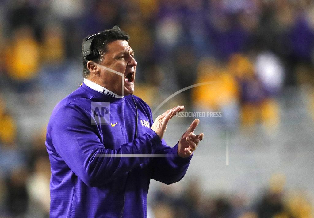 LSU head coach Ed Orgeron calls out from the sideline in the second half of an NCAA college football game against Rice in Baton Rouge, La., Saturday, Nov. 17, 2018. (AP Photo/Gerald Herbert)