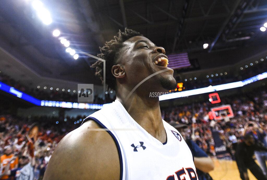 Julie Bennett Auburn player Malik Dunbar (4) celebrates the Tigers' 84-80 win over Tennessee after an NCAA college basketball game Saturday, March 9, 2019, in Auburn, Ala. (AP Photo/Julie Bennett)