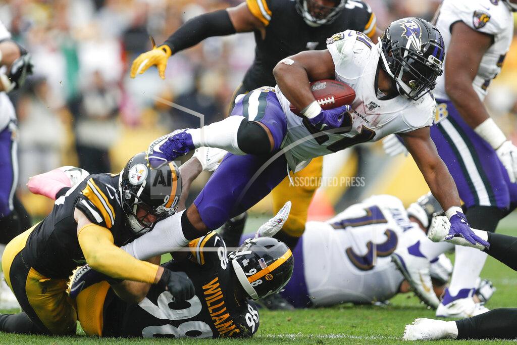 Don Wright Baltimore Ravens running back Mark Ingram (21) is hit by Pittsburgh Steelers linebackers T.J. Watt (90) and Vince Williams on a run in the second half of an NFL football game, Sunday, Oct. 6, 2019, in Pittsburgh. The Ravens won 26-23. (AP Photo/Don Wright)