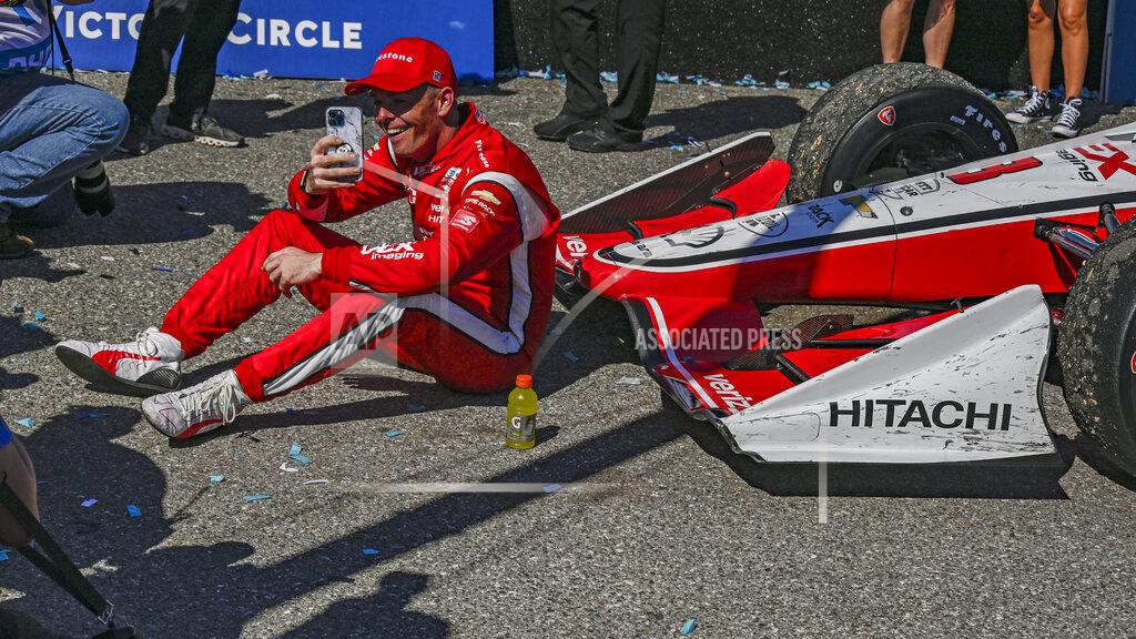 Steve Nesius Scott McLaughlin, the driver for Dex Imaging Team Penske (car 3) makes a video call with family back in New Zealand after winning the Grand Prix of St. Petersburg Sunday, Feb.27, 2022, in St. Petersburg, Fla. (AP Photo/Steve Nesius)