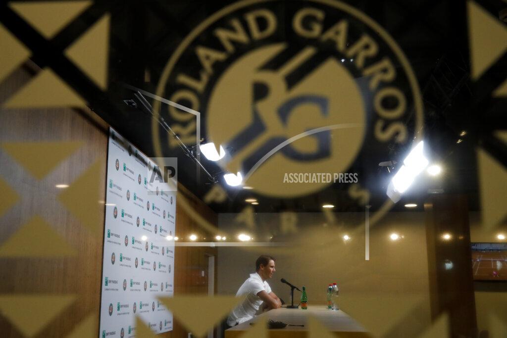 Christophe Ena Spain's Rafael Nadal answers questions of journalist via a video connection in an empty press conference room after his first round match of the French Open tennis tournament at the Roland Garros stadium in Paris, France, Monday, Sept. 28, 2020. (AP Photo/Christophe Ena)