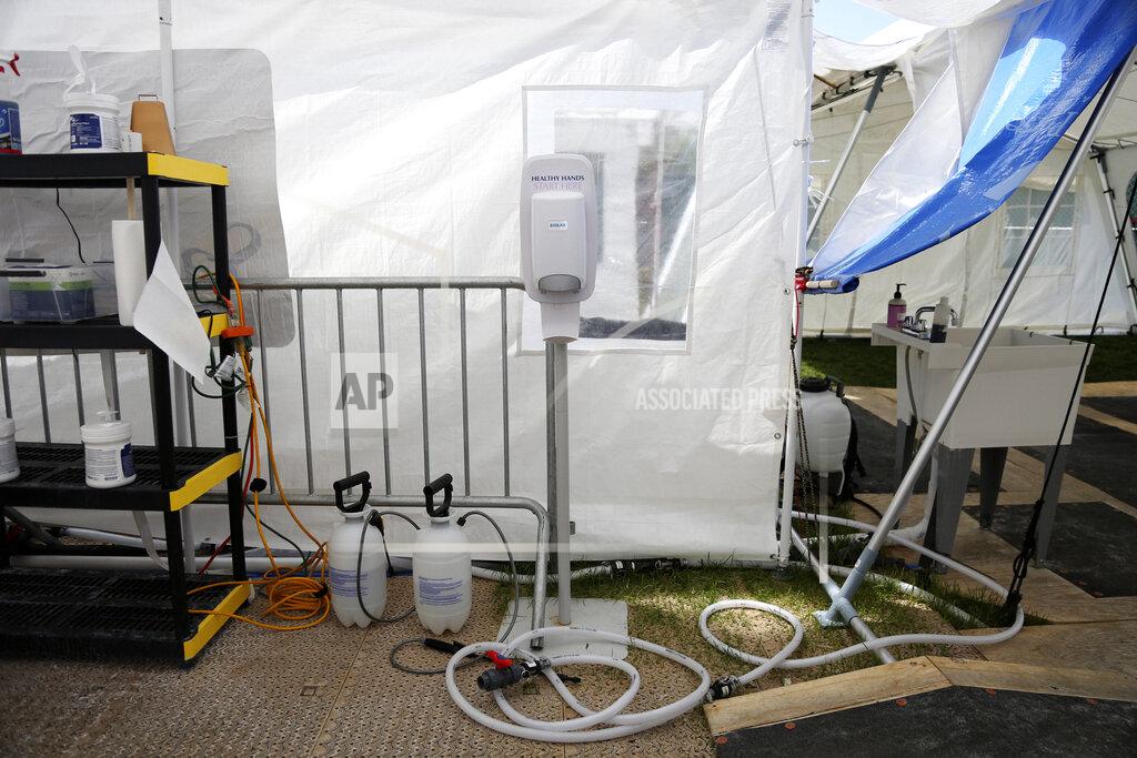 Jessie Wardarski Sanitizing tools used by Samaritan's Purse health care workers are located in the field hospital's doffing station, or area for PPE removal, in New York's Central Park Thursday, May 7, 2020. The Christian relief charity is set to conclude their coronavirus efforts at the end of next week. (AP Photo/Jessie Wardarski)