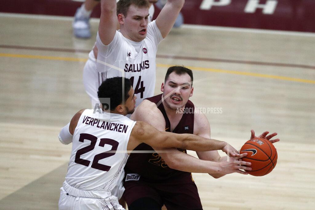 Shafkat Anowar Loyola Chicago center Cameron Krutwig is pressured by Southern Illinois' Steven Verplancken Jr. (22) and Kyler Filewich during the second half of an NCAA college basketball game Saturday, Feb. 27, 2021, in Chicago. (AP Photo/Shafkat Anowar)