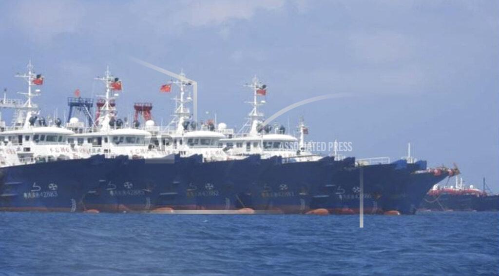 Uncredited In this March 7, 2021, photo provided by the Philippine Coast Guard/National Task Force-West Philippine Sea, some of the 220 Chinese vessels are seen moored at Whitsun Reef, South China Sea. The Philippine government expressed concern after spotting more than 200 Chinese fishing vessels it believed were crewed by militias at a reef claimed by both countries in the South China Sea, but it did not immediately lodge a protest. (Philippine Coast Guard/National Task Force-West Philippine Sea via AP)