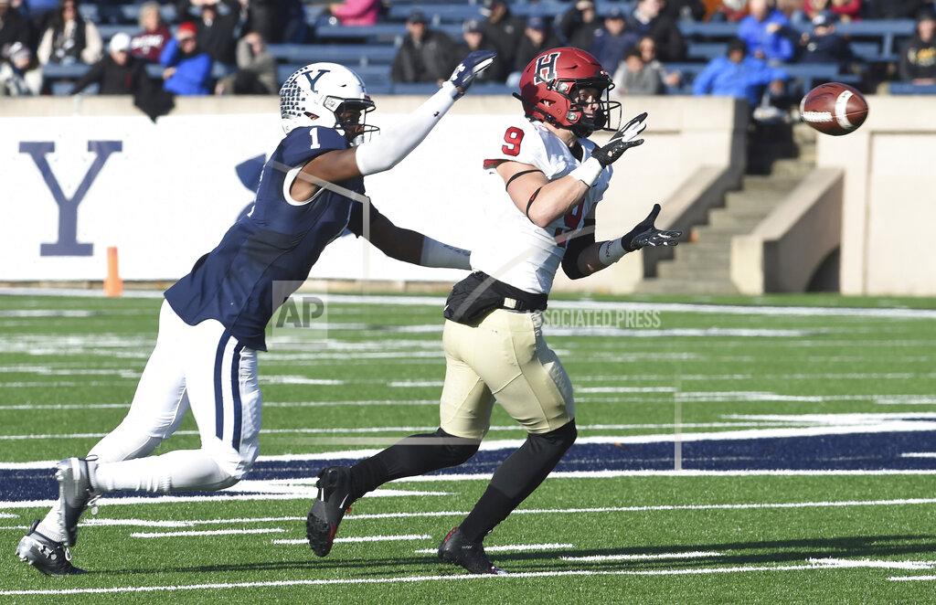 Arnold Gold Harvard's Cody Chrest makes a reception as Yale's Malcolm Dixon defends during the first half during an NCAA college football game, Saturday, Nov. 23, 2019, in New Haven, Conn. (Arnold Gold/New Haven Register via AP)