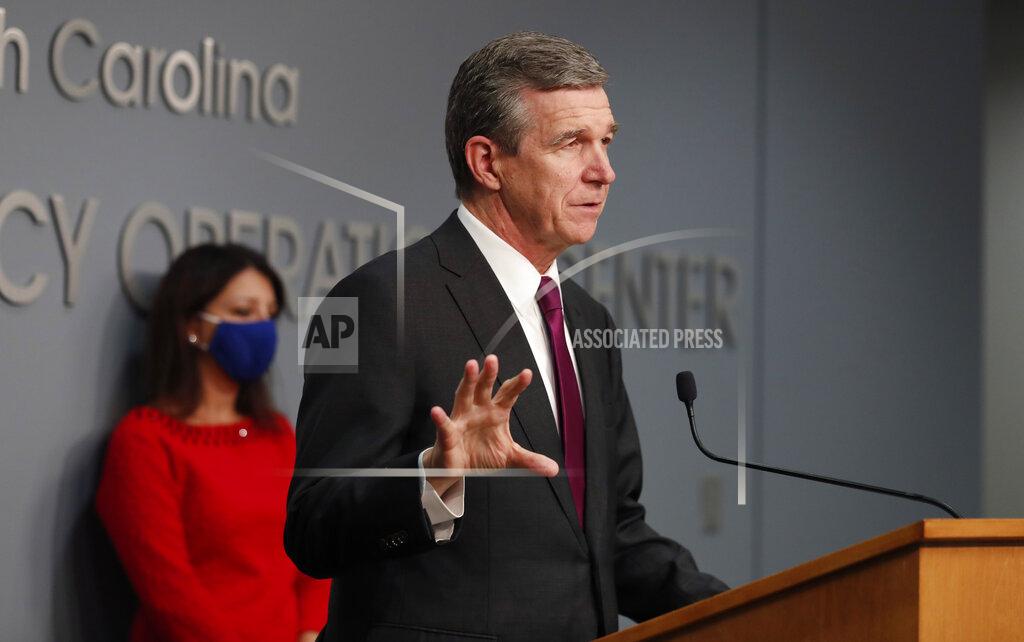 Ethan Hyman Gov. Roy Cooper answers a question during a briefing at the Emergency Operations Center in Raleigh, N.C., Wednesday, Oct. 28, 2020. Democratic Gov. Roy Cooper signed an executive order on Wednesday preventing landlords from evicting tenants who are unable to pay their rent. (Ethan Hyman/The News & Observer via AP)