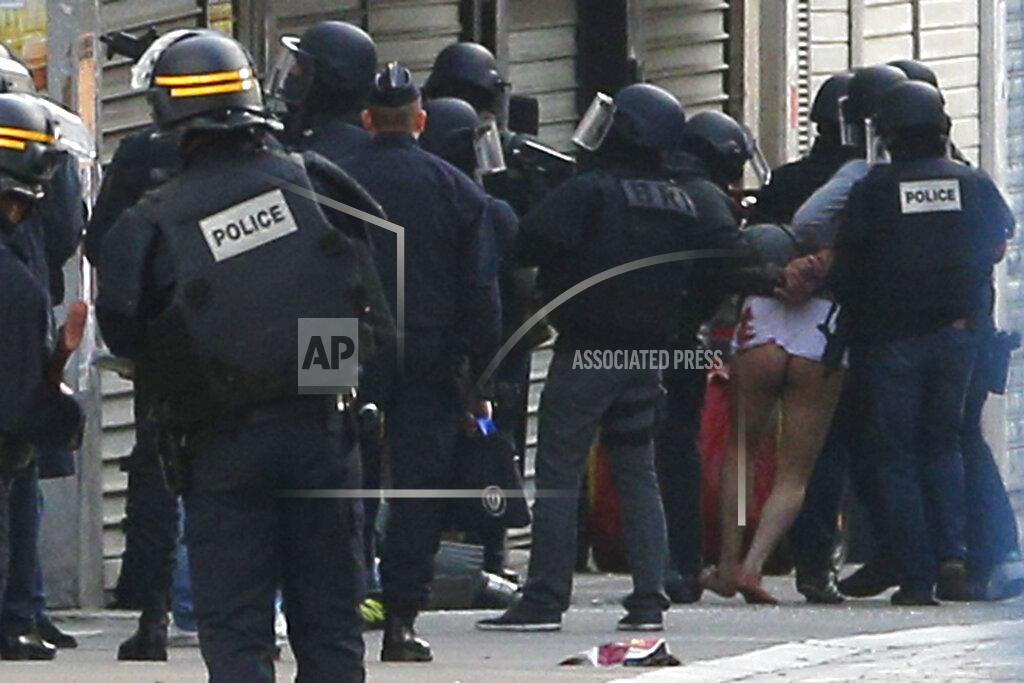 Christophe Ena FILE - In this Nov. 18, 2015 file photo police forces arrest a man in Saint-Denis, a northern suburb of Paris. On Nov. 13, 2015, a cell of nine Islamic State militants armed with automatic rifles and explosive vests left a trail of dead and injured at the national stadium, Paris bars and restaurants and the Bataclan concert hall. Nearly all the attackers were from France or Belgium, as were the cell's 10th member — the only one still alive. He is the chief defendant among 20 people charged in a trial that is expected to last nine months. (AP Photo/Christophe Ena, File)