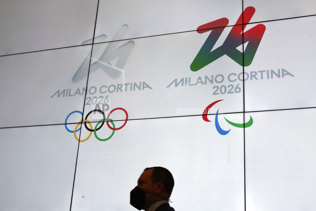 Alessandra Tarantino The logo of 2026 Milan-Cortina Olympics and Paralympics (at right) are unveiled to the journalists at a press conference in Rome, Tuesday, March 30, 2021. In an online vote, nearly a million votes were cast -- 871,566 to be exact -- over the last two weeks from Italy and 168 other nations for the two finalists. The “Futura” logo received 75 percent of the votes, winning easily ahead of the more traditional “Dado” option. (AP Photo/Alessandra Tarantino)