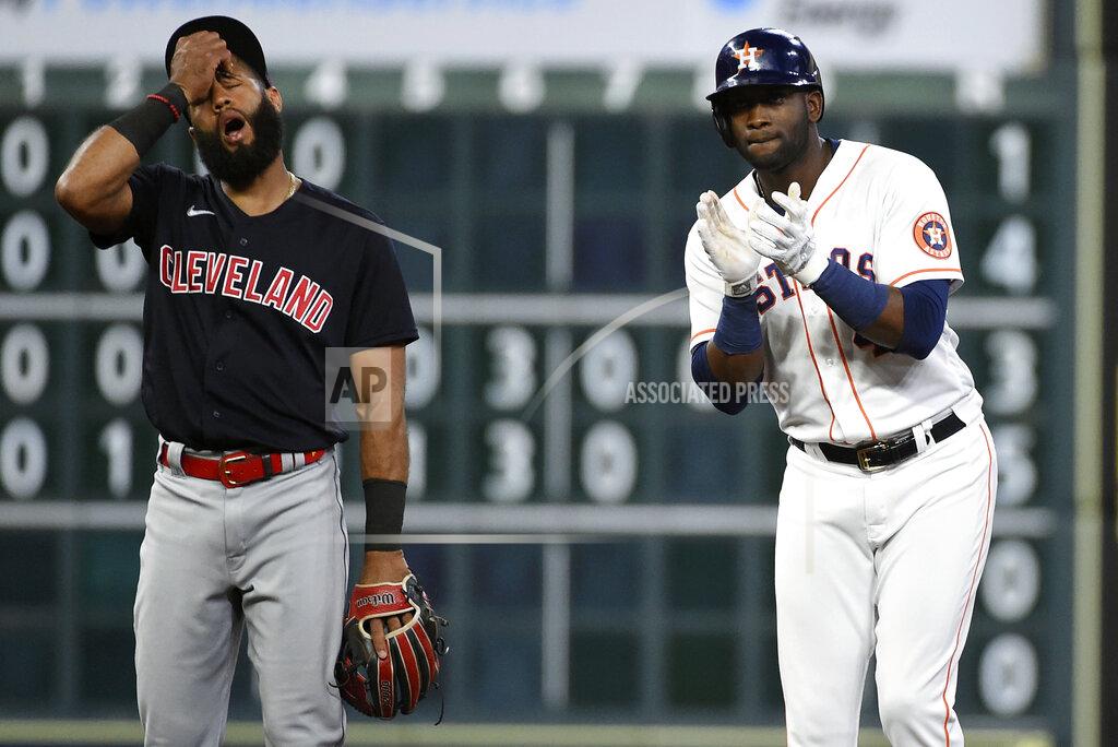 Eric Christian Smith Houston Astros' Yordan Alvarez, right, reacts after hitting a two-run double, next to Cleveland Indians shortstop Amed Rosario during the fifth inning of a baseball game, Tuesday, July 20, 2021, in Houston. (AP Photo/Eric Christian Smith)