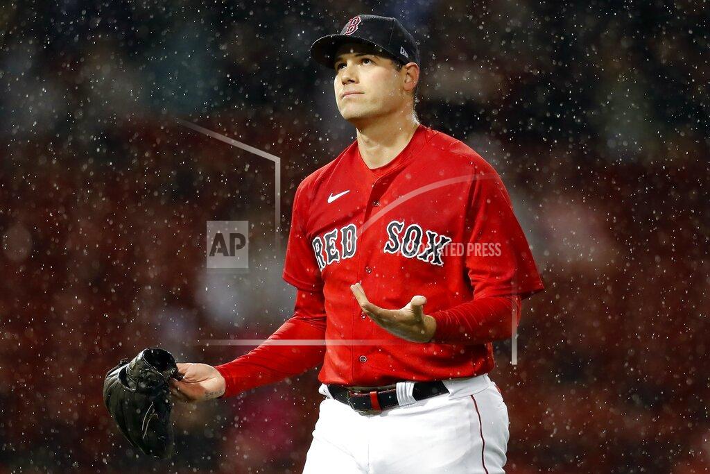 Michael Dwyer Boston Red Sox's Adam Ottavino reacts in the rain after striking out Miami Marlins' Isan Diaz with bases loaded to end the top of the sixth inning during a baseball game, Friday, May 28, 2021, in Boston. The game went into rain delay in the sixth inning and was called after an hour. (AP Photo/Michael Dwyer)