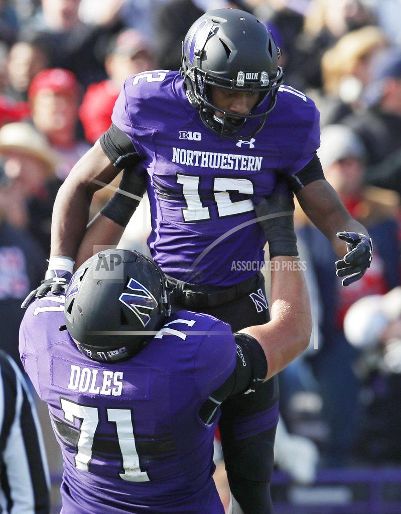 Jim Young Northwestern's JJ Jefferson, top, is lifted in the air by teammate Tommy Doles as they celebrate a touchdown against Nebraska during the second half of an NCAA college football game Saturday, Oct. 13, 2018, in Evanston, Ill. (AP Photo/Jim Young)
