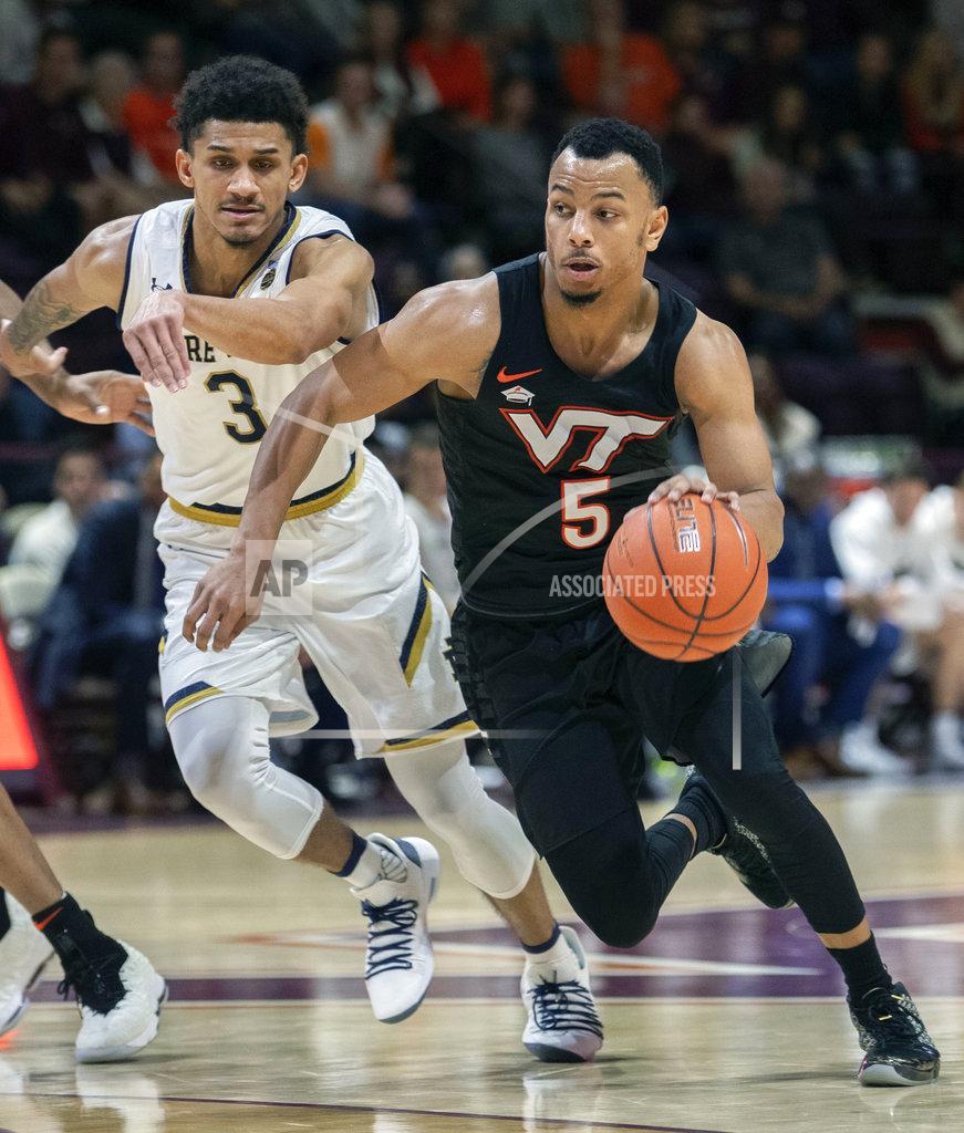 Don Petersen Virginia Tech guard Justin Robinson (5) drives the ball to the basket against Notre Dame guard Prentiss Hubb (3) during the second half of an NCAA college basketball game Tuesday, Jan. 1, 2019, in Blacksburg, Va. Virginia Tech won 81-66. (AP Photo/Don Petersen)