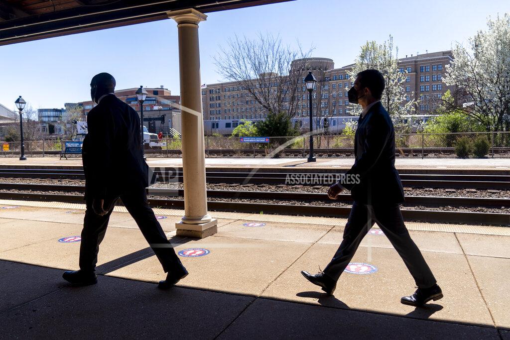 Andrew Harnik FILE - In this March 30, 2021, file photo Transportation Secretary Pete Buttigieg, right, departs a news conference to announce the expansion of commuter rail in Virginia at the Amtrak and Virginia Railway Express (VRE) Alexandria Station in Alexandria, Va. (AP Photo/Andrew Harnik, File)