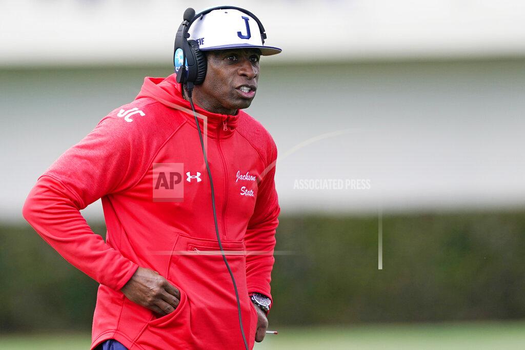 Rogelio V. Solis Jackson State football coach Deion Sanders calls out to his players during the first half of an NCAA college football against Edward Waters in Jackson, Miss., Sunday, Feb. 21, 2021. The game marks Sanders's collegiate head coaching debut. (AP Photo/Rogelio V. Solis)