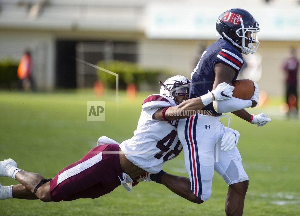 Eric Shelton Jackson State Daylen Baldwin is stopped by Alabama A&M's JaBraun McNeal during an NCAA college football game, Saturday, April 10, 2021, at Veterans Memorial Stadium in Jackson, Miss. (Eric Shelton/The Clarion-Ledger via AP)