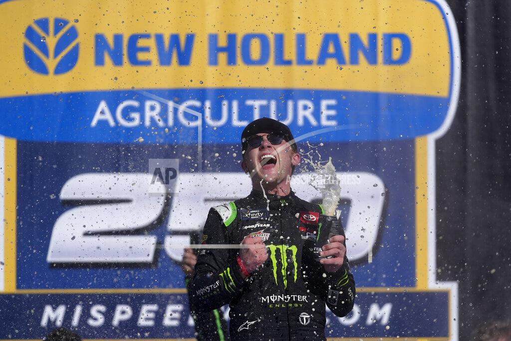 Paul Sancya Ty Gibbs celebrates winning the New Holland 250 NASCAR Xfinity Series auto race at the Michigan International Speedway in Brooklyn, Mich., Saturday, Aug. 6, 2022. (AP Photo/Paul Sancya)
