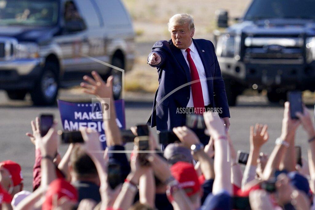 Ross D. Franklin President Donald Trump waves to a cheering crowd as he arrives for a campaign rally Monday, Oct. 19, 2020, in Tucson, Ariz. (AP Photo/Ross D. Franklin)