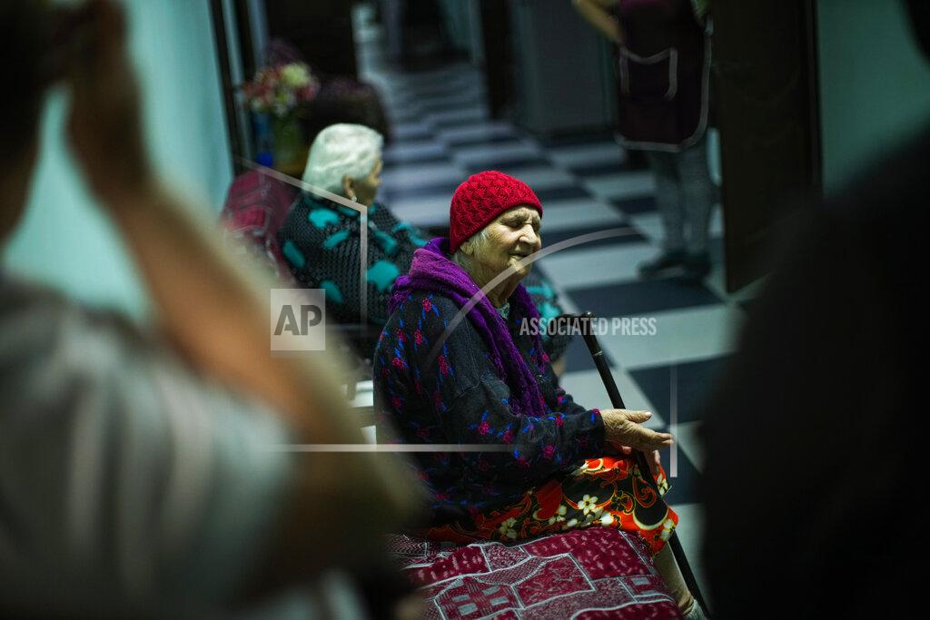 Francisco Seco Anna Loboda, 93, a former choir member who fled from Donetsk region, sings a song at Saint Michael monastery, in Odesa, Ukraine, Friday, May 13, 2022. Loboda, who has no family, has been living in the monastery's facility for the elderly since she was brought to Odesa by a neighbour before Russian forces took over her village. (AP Photo/Francisco Seco)