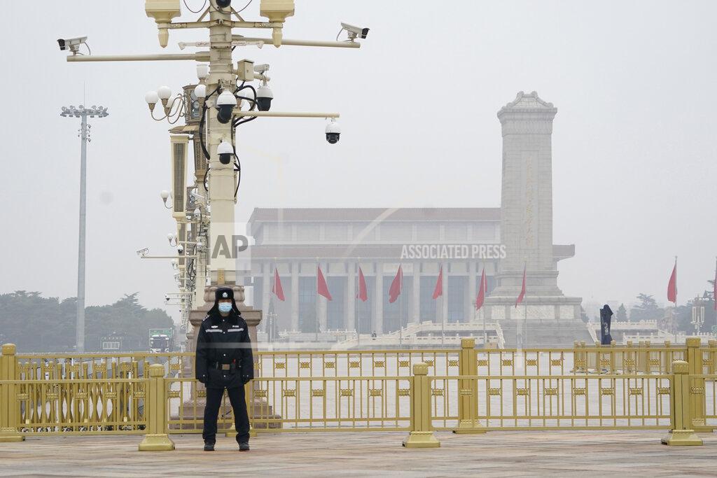 Ng Han Guan A Chinese police officer guards an empty Tiananmen Square near the Great Hall of the People in Beijing on Wednesday, March 3, 2021. In a sign of confidence China has reverted back to holding its annual Congress meetings to march this year after delaying them due to the outbreak of the coronavirus last year. As usual, security has been tightened in the capital with paramilitary troops patrolling near the Great Hall of the People where the meetings are held and standing guard at subway stations. (AP Photo/Ng Han Guan)