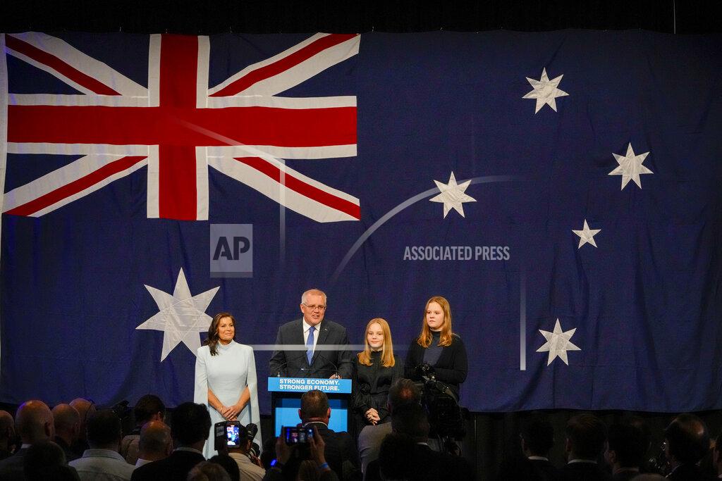 Mark Baker Australian Prime Minister Scott Morrison address a Liberal Party function with his wife Jenny and daughter's Lily and Abbey in Sydney, Australia, Saturday, May 21, 2022. Morrison has conceded defeat and has confirmed that he would hand over the leadership of the Liberal Party following his party's loss to Labor in today's federal election. (AP Photo/Mark Baker)