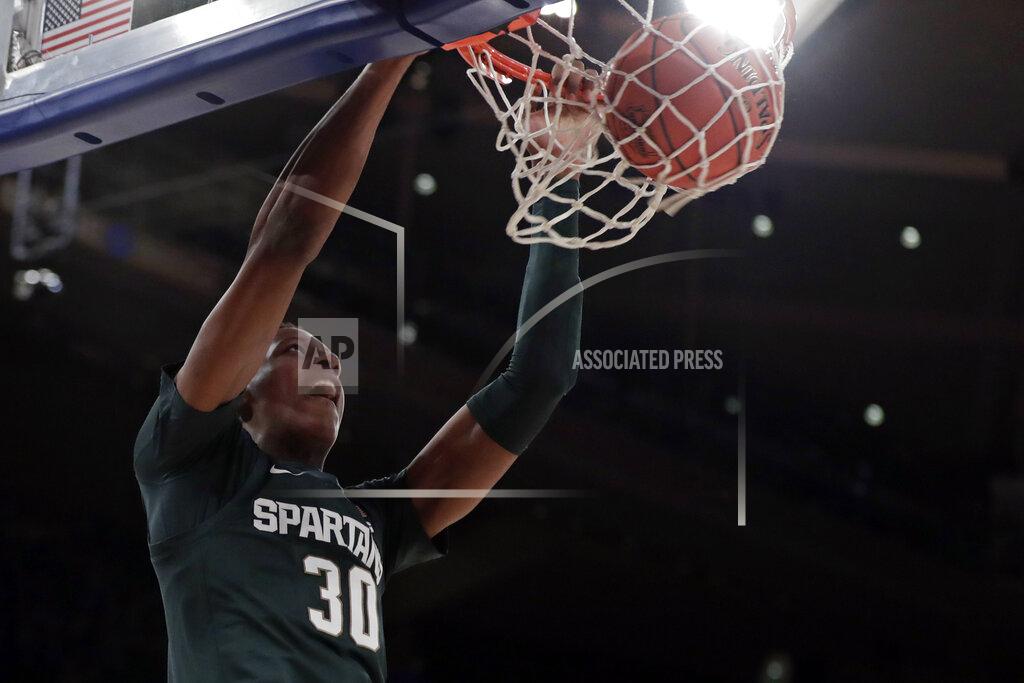 Adam Hunger Michigan State forward Marcus Bingham Jr. (30) dunks during the first half of the team's NCAA college basketball game against Kentucky on Tuesday, Nov. 5, 2019, in New York. (AP Photo/Adam Hunger)
