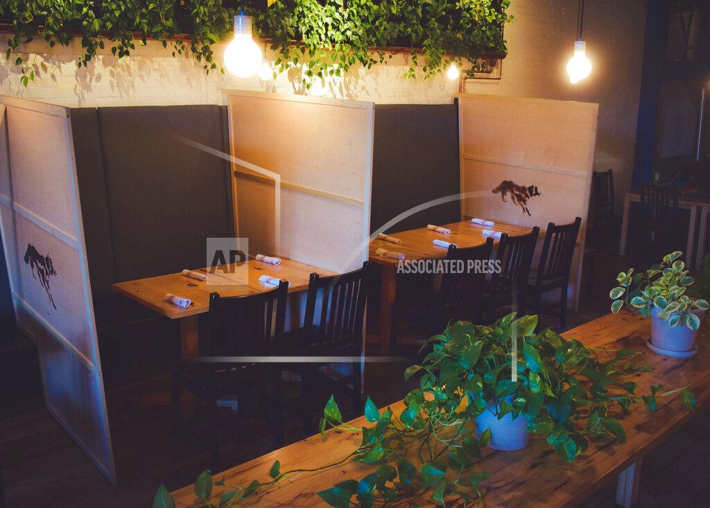 In a June 2020 photo provided by Wolf's Ridge Brewing is the dining room at Wolf's Ridge Brewing in Columbus, Ohio. Wolf’s Ridge Brewing has had to close its dining room and return to takeout and delivery, having used its PPP money and not having enough revenue due to social distancing, amid the coronavirus pandemic. (Jenny Hauck/Wolf's Ridge Brewing via AP)