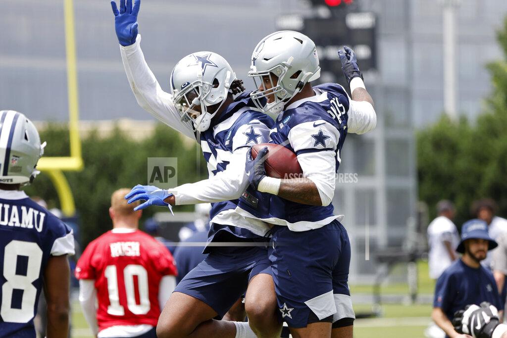 Michael Ainsworth Dallas Cowboys cornerback Trevon Diggs, left, celebrates with Micah Parsons, right, after Parsons made an interception during NFL football practice in Frisco, Texas, Thursday, June 3, 2021. (AP Photo/Michael Ainsworth)
