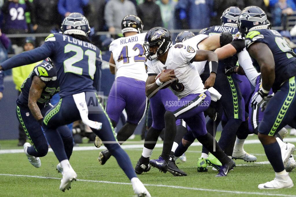 Elaine Thompson Baltimore Ravens quarterback Lamar Jackson (8) keeps the ball for a touchdown on a fourth-down play against the Seattle Seahawks during the second half of an NFL football game, Sunday, Oct. 20, 2019, in Seattle. (AP Photo/Elaine Thompson)