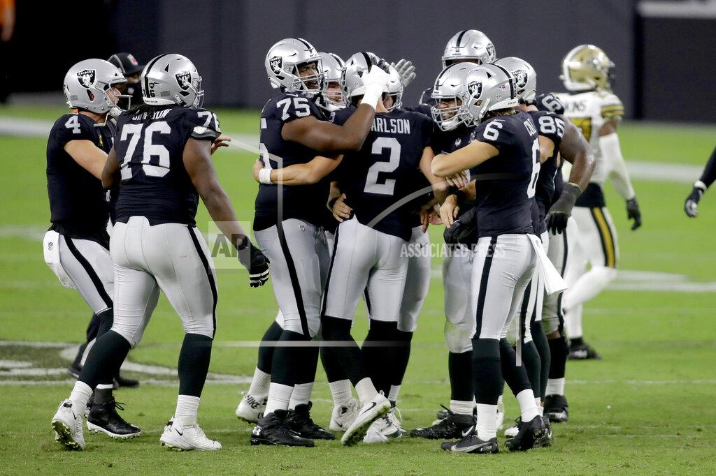 Isaac Brekken Las Vegas Raiders players celebrate after kicker Daniel Carlson (2) scored a 54 yard field goal against the New Orleans Saints during the second half of an NFL football game, Monday, Sept. 21, 2020, in Las Vegas. (AP Photo/Isaac Brekken)