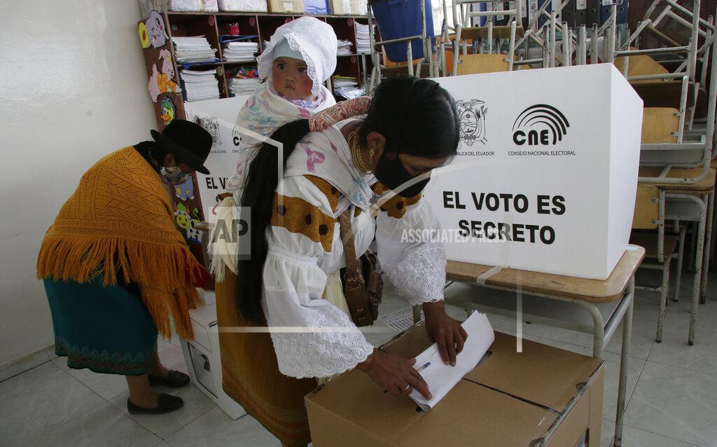 Dolores Ochoa Women cast their ballots in Cangahua, Ecuador, Sunday, Feb. 7, 2021. Ecuadoreans went to the polls in first-round presidential legislative elections. (AP Photo/Dolores Ochoa)