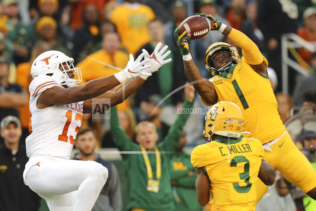Richard W. Rodriguez Baylor cornerback Grayland Arnold (1) intercepts a pass intended for Texas wide receiver Brennan Eagles (13) in the third quarter of an NCAA college football game Saturday, Nov. 23, 2019, in Waco, Texas. (AP Photo/Richard W. Rodriguez)